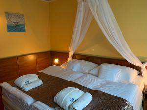 Postel nebo postele na pokoji v ubytování Hotel Therma Dunajská Streda