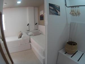 Postel nebo postele na pokoji v ubytování Sosiego Hostal de Mar