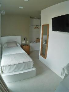 Postel nebo postele na pokoji v ubytování Sosiego Hostal de Mar