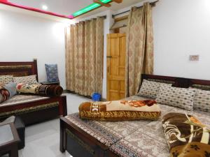 Krevet ili kreveti u jedinici u okviru objekta New Balakot Hotel