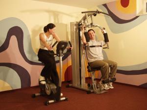 a man and a woman exercising in a gym at AngerResidenz in Zwiesel