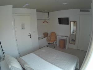 Postel nebo postele na pokoji v ubytování Sosiego Hostal de Mar