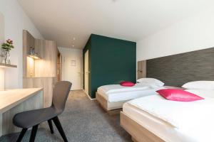 Postel nebo postele na pokoji v ubytování Hotel Gasthof Krone