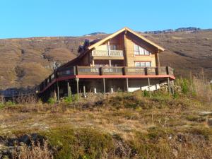 a house on top of a hill at Guesthouse Elínar Helgu in Fáskrúðsfjörður