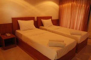 מיטה או מיטות בחדר ב-Chaisiri Park View