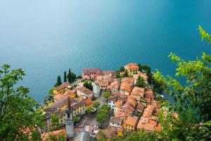 an aerial view of a town on the edge of the water at Albergo Del Sole in Varenna