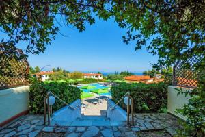 a view of a swimming pool from a house at Palladium Hotel in Kriopigi