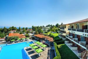 an aerial view of a resort with a swimming pool and patio at Palladium Hotel in Kriopigi