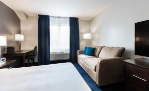 Postelja oz. postelje v sobi nastanitve Imperia Hotel & Suites Saint-Eustache