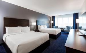 Postelja oz. postelje v sobi nastanitve Imperia Hotel & Suites Saint-Eustache