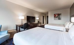 Postelja oz. postelje v sobi nastanitve Imperia Hotel & Suites Saint-Eustache