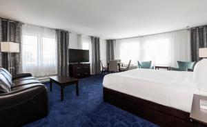 Postelja oz. postelje v sobi nastanitve Imperia Hotel & Suites Saint-Eustache