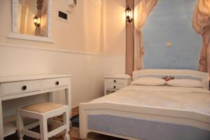Voodi või voodid majutusasutuse Dorian Hotel toas