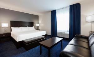 Postelja oz. postelje v sobi nastanitve Imperia Hotel & Suites Saint-Eustache