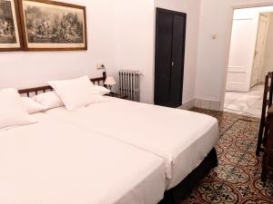 Posteľ alebo postele v izbe v ubytovaní Hotel Simon