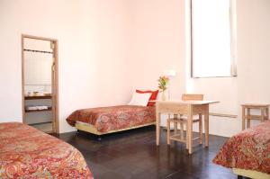 A bed or beds in a room at Casa Oniri Hotel Boutique