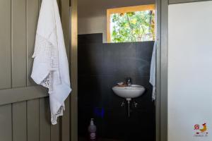 a bathroom with a sink and a window at Casale13 in Faenza