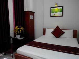 Ένα ή περισσότερα κρεβάτια σε δωμάτιο στο Kara Beachside Guesthouse