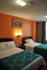 Postel nebo postele na pokoji v ubytování Hotel Makroz