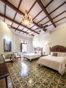 Tempat tidur dalam kamar di Casa Tavera- Adults Only