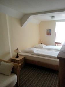 Кровать или кровати в номере Hotel Alte Rathausschänke