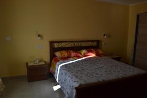 A bed or beds in a room at CASA DEL MINATORE