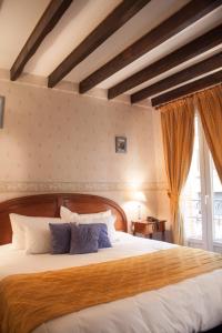 Postel nebo postele na pokoji v ubytování Hôtel Riquet