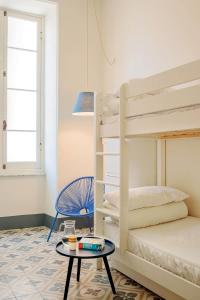 a kids room with bunk beds and a table at Costello in La Spezia