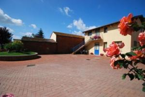 a brick driveway in front of a house at Komote in San Zeno