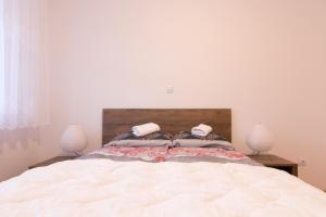 Postel nebo postele na pokoji v ubytování Apartman Carica