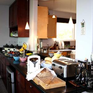 a kitchen with a counter top with some food on it at Susitna Place B&B in Anchorage