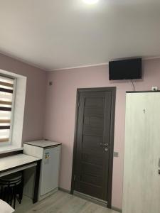 Televiisor ja/või meelelahutuskeskus majutusasutuses Guest House MAX +37 fotot