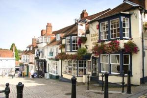 a group of buildings on a cobblestone street at Courtyard Cottages Lymington, 2 Adults only in Lymington