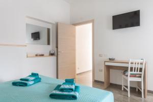 Postel nebo postele na pokoji v ubytování 40° Parallelo Guest House