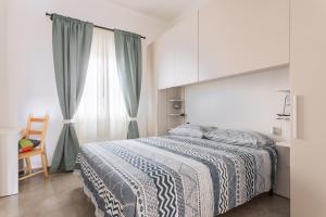Postel nebo postele na pokoji v ubytování 40° Parallelo Guest House