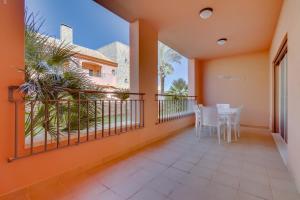 a balcony with a table and chairs on it at Victoria Boulevard - Vasco da Gama - Vilamoura in Vilamoura