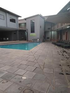 a swimming pool in the middle of a building at Green Side accommodation in Rustenburg