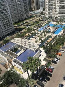 an aerial view of a parking lot with a pool at Apartamento Parque Olímpico in Rio de Janeiro
