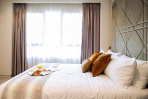 Posteľ alebo postele v izbe v ubytovaní Voghe Premium Flats