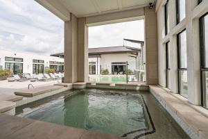 an exterior view of a house with a swimming pool at Spacious Getaway in Central Location + Pool in Houston