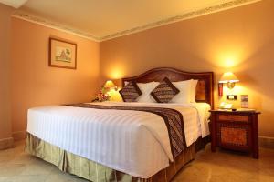 Postel nebo postele na pokoji v ubytování Ambhara Hotel