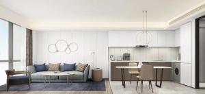 a living room with a couch and a table at Ascott Raffles City Chongqing in Chongqing