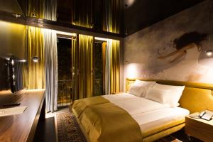 En eller flere senger på et rom på Hotel Hemera