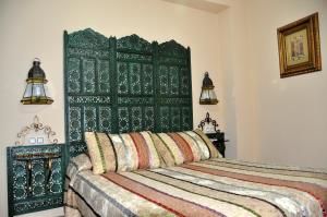 Posteľ alebo postele v izbe v ubytovaní Apartamentos Boutique Doña Maria La Brava