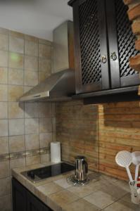 Kuchyňa alebo kuchynka v ubytovaní Apartamentos Boutique Doña Maria La Brava
