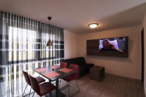 A television and/or entertainment centre at iQ-Hotel