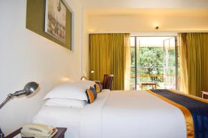 Eighth Bastion Fort Kochi - A CGH Earth Experience房間的床