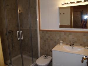 a bathroom with a shower and a toilet and a sink at La Xaquera in Busot +25 photos