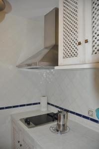 Kuchyňa alebo kuchynka v ubytovaní Apartamentos Boutique Doña Maria La Brava