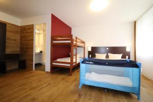 Postel nebo postele na pokoji v ubytování iQ-Hotel